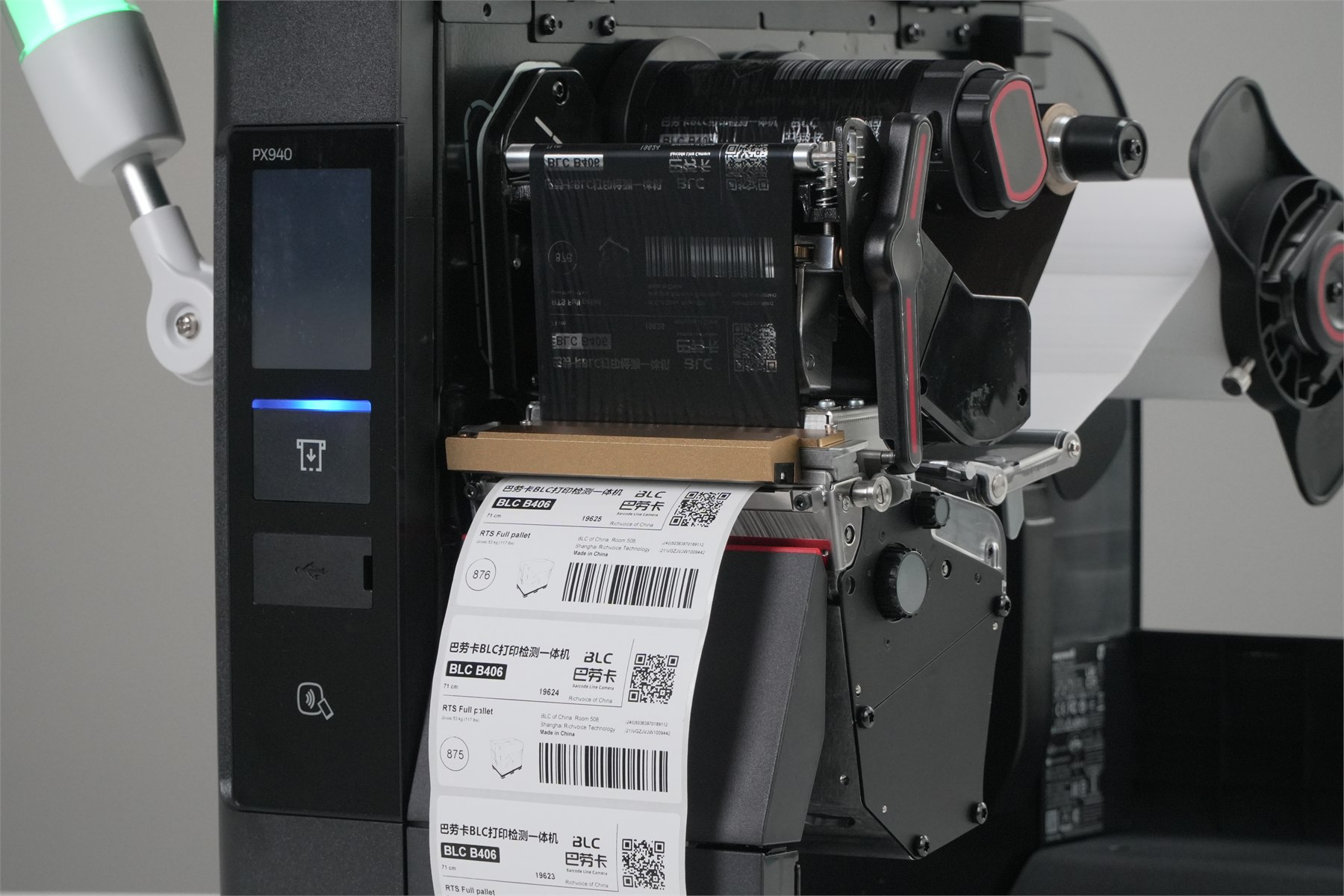 Honeywell PX940 industrial printer with BLC inline label inspection installed at the label exit